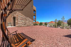 View of yard featuring a mountain view and a balcony