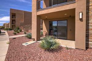 Property entrance with a balcony