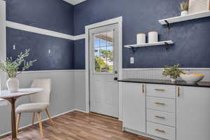 Doorway featuring hardwood / wood-style floors