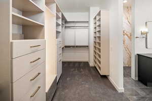 Primary Walk in closet with lighted mirror