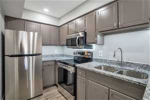 Kitchen with All New Stainless Steel Appliances & New Granite Countertops