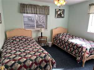 Bedroom with dark colored carpethttps://assets.utahrealestate.com/photos/280x210/hb4531753_6755ca7f484da5350c1cbbc867e827fa_65459cfa1b91f.jpg