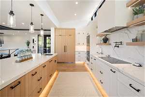 Level 1 Kitchen: Monogram appliances, instant hot water, drawer dishwashers, full size dishwasher.