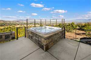 Exterior Exterior: Hot tub with a view of the Valley and Mountains. Stone linear remote fireplace. Access from Primary bedroom.