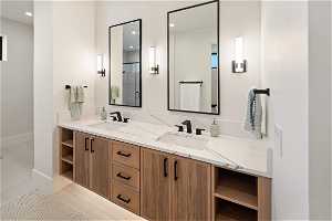 Basement 1 Bathroom: Guest bathroom, double vanity, undercabinet lighting, tile flooring, large walk in closet.
