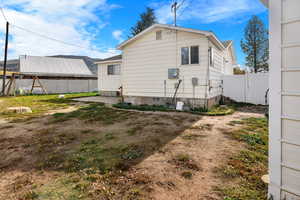 Back of property with a patio