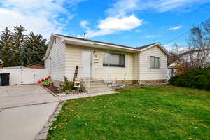 View of front of property with a front lawn