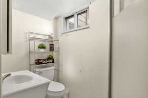 Bathroom featuring vanity and toilet