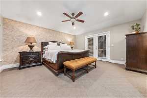 Bedroom featuring ceiling fan, access to outside, and light colored carpet
