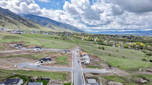 Birds eye view of property with a mountain view
