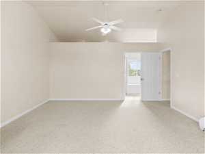 Master Bedroom featuring light colored carpet, ceiling fan, and high vaulted ceiling