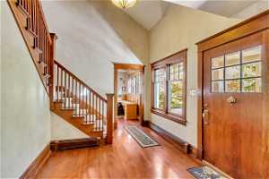 Entryway with light hardwood / wood-style flooring, a baseboard radiator, and a healthy amount of sunlight