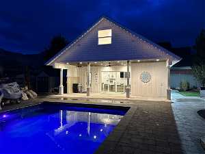 Pool and pool house at night