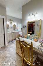 EXAMPLE ONLY - Bathroom featuring tile floors, a textured ceiling, and vanity