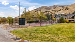 Exterior space featuring a yard and a mountain view