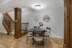 Dining area with light hardwood / wood-style flooring