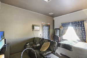 Bedroom with an AC wall unit