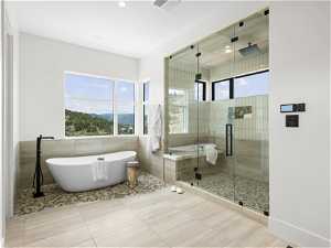 Bathroom with separate shower and tub and tile flooring