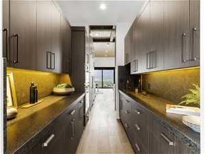 Butlers pantry featuring light hardwood / wood-style flooring, modern cabinets, oven, and backsplash