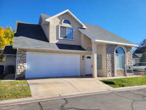 View of property featuring a garage