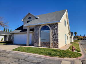 View of front of property with a garage