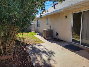 View of yard featuring a patio area and central air condition unit