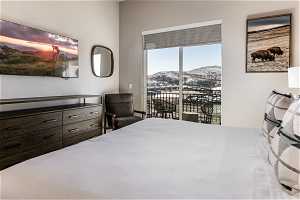 Bedroom featuring access to outside and a mountain view
