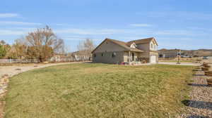 View of yard with a garage