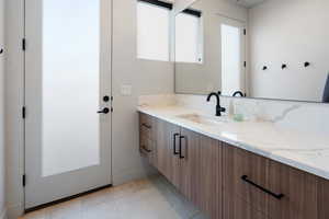 Bathroom with tile floors and vanity