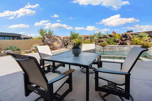 View of patio / terrace with a fenced in pool