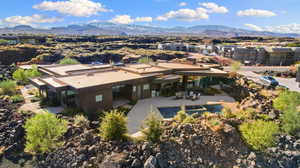 Birds eye view of property featuring a mountain view