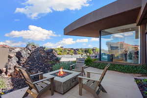 View of patio / terrace with an outdoor fire pit