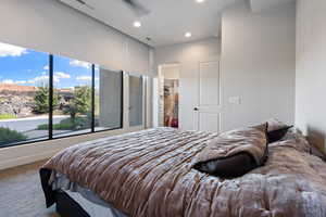 Bedroom with ceiling fan and carpet floors