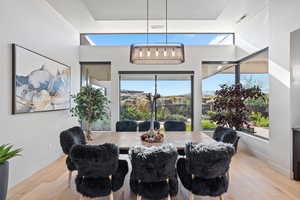 Dining space with light hardwood / wood-style floors