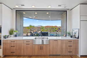 Kitchen featuring light wood-type flooring and sink