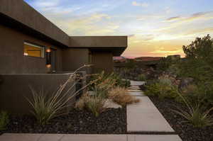 View of property exterior at dusk