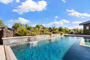 View of pool with pool water feature