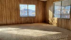 Featuring wooden walls and carpet