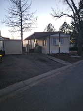 Manufactured / mobile home featuring a carport