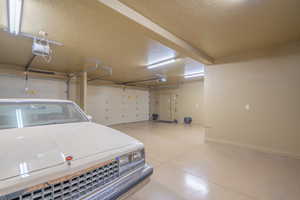 Garage featuring a garage door opener