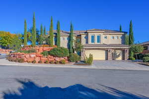 Mediterranean / spanish home featuring a garage