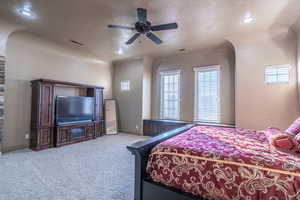 Master Bedroom featuring light colored carpet and ceiling fan