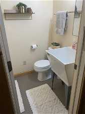 Bathroom featuring toilet, shower and sink