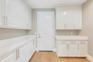 Laundry room featuring light hardwood / wood-style floors