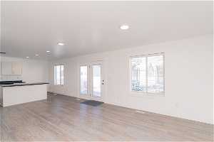 Unfurnished living room featuring light LVP floors