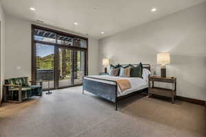 Bedroom featuring light colored carpet and access to exterior