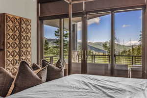 Bedroom featuring a mountain view and access to exterior