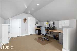 Detached Garage carpeted office space with lofted ceiling
