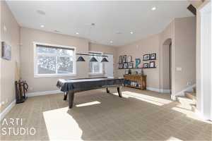 Rec room with light colored carpet and pool table