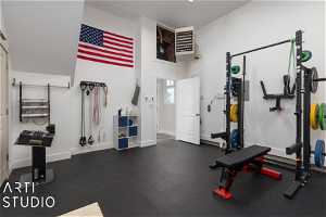 Detached Garage exercise room with a towering ceiling